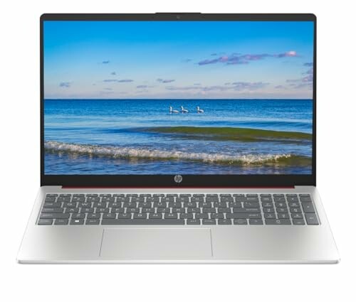 Open laptop displaying beach wallpaper