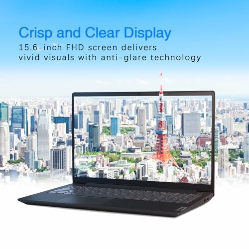 Laptop with a cityscape displayed on the screen and text about a 15.6-inch FHD screen.