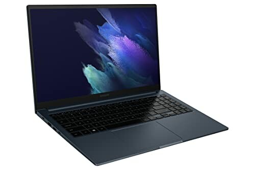 Sleek laptop with dark finish and illuminated screen.