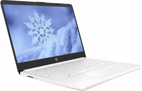 White laptop displaying a snowflake on the screen